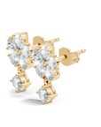 Yellow gold stud lab grown earrings featuring pear cut diamonds arranged in a cascading drop design