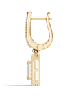 Side view of gold hoop earring with geometric drop and baguette lab grown diamond