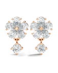 rose gold lab grown diamond earrings emphasizing a rounded floral design with diamond drop