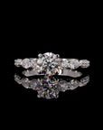 Dazzling Unity: Solitaire Engagement Ring with Side Pear Diamond.