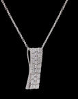 Awaken’s Emerald Radiance:  Sterling Long Diamond Pendant