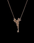 Awaken’s Pear Patel Elegance:  Flower Diamond Pendant