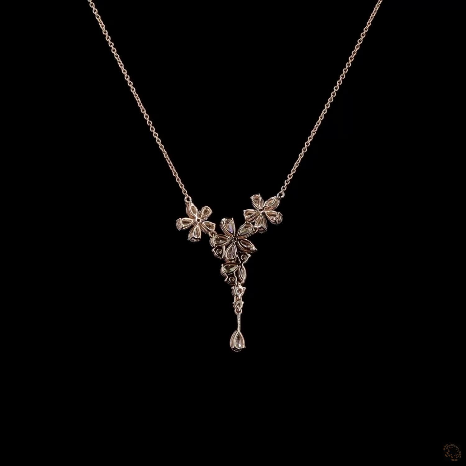 Awaken’s Pear Patel Elegance:  Flower Diamond Pendant