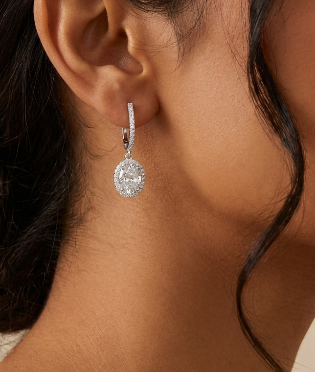  woman wearing a silver Halo Diamond earring 