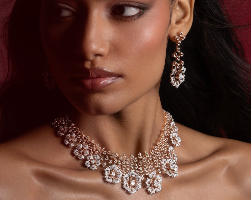 Luxury diamond necklace and matching earrings on a woman