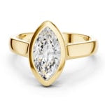 Lab grown diamond ring showcasing a marquise cut center embraced by a yellow gold border.